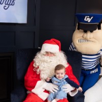 Happy baby boy on Santa's lap